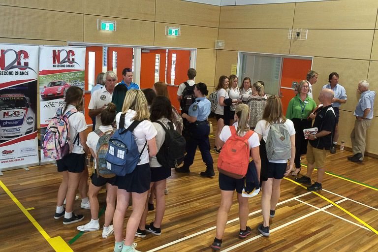 Students take a moment to ask questions after the presentation at Denison College Bathurst