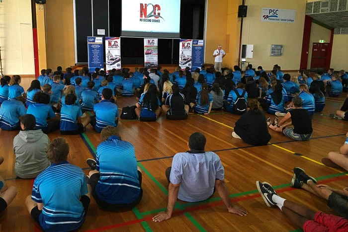 Paul Stanley addresses students seated in the Palmerston Senior College gym