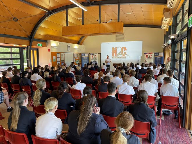 Warren Luff speaking to the students at Assisi Catholic College